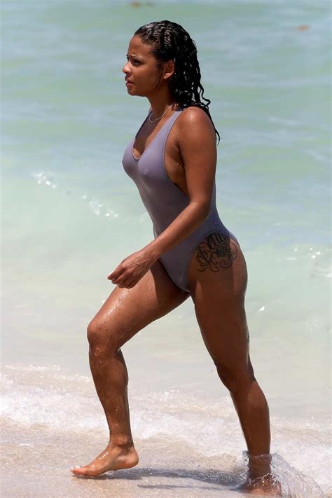 Christina Milian In Purple Swimsuit Hits The Ocean In