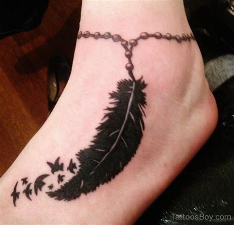 Awesome Feather Tattoo On Foot Tattoo Designs Tattoo Pictures