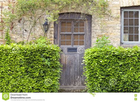 Old House Doors In English Traditional Stone Cottage Stock Photo