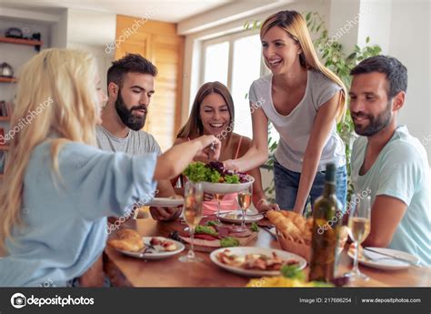 Group Friends Eating Lunch Together Having Great Time Home Stock Photo By Ivanko