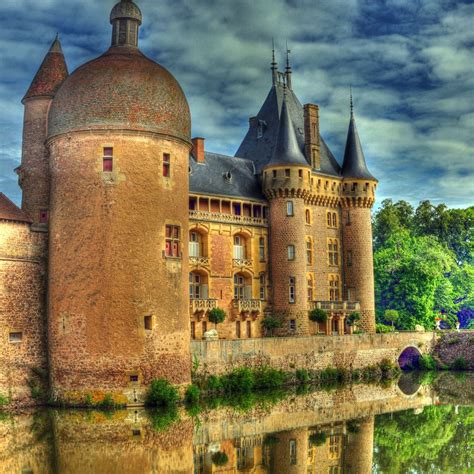 castle in burgundy unusual buildings ancient buildings fantasy castle fairytale castle