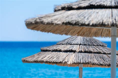 Beach Umbrellas Made Of Straw On A Beach Stock Image Image Of Vacation Stalk