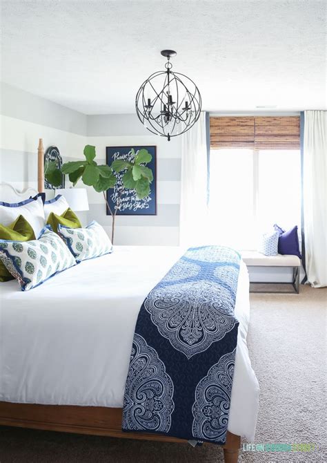 Blue and white take center stage in this fresh yet classic bedroom by eliza crater. Furniture - Bedrooms : Guest bedroom with woven shades ...