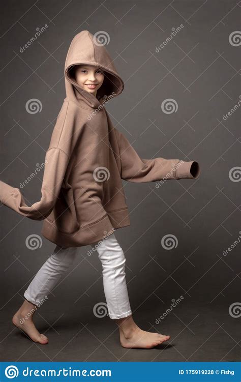 Child Girl With Long Hair Gathered In A Bun Stock Photo Image Of