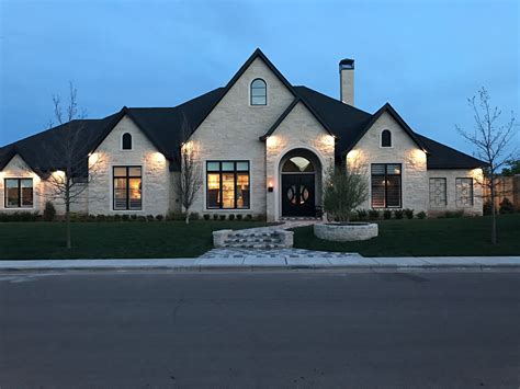 2030 White Brick House With Stone Accent