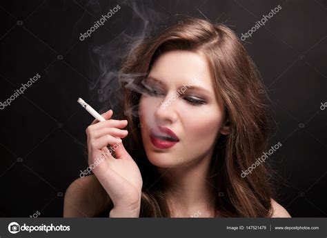 Beautiful Woman With Cigarette Stock Photo By ©belchonock 147521479