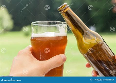 Cheers Glass And Bottle Of Beer Stock Photo Image Of Forest Couple
