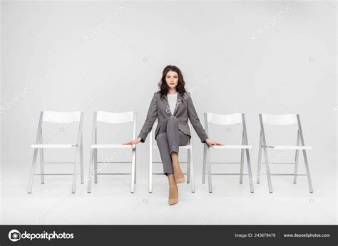 Confident Woman Sitting Crossed Legs Chair Isolated Grey — Stock Photo