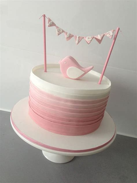 Ombré pink cake with bird topper for a christening by  