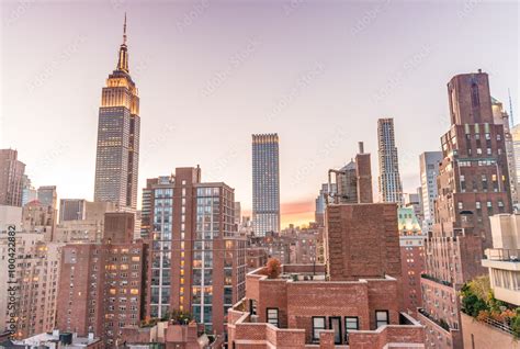 New York Skyline From Rooftop Sunset Over Manhattan Stock Photo