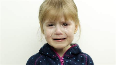 Portrait Of Little Child Girl Crying With Tears On Her Eyes White