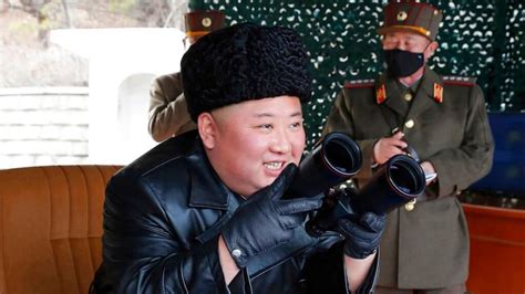 kim jong un watches north korea military drill with masked officers by his side world news