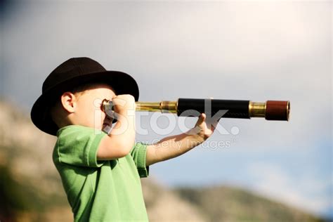 Young Boy Looking Through A Telescope Stock Photo Royalty Free