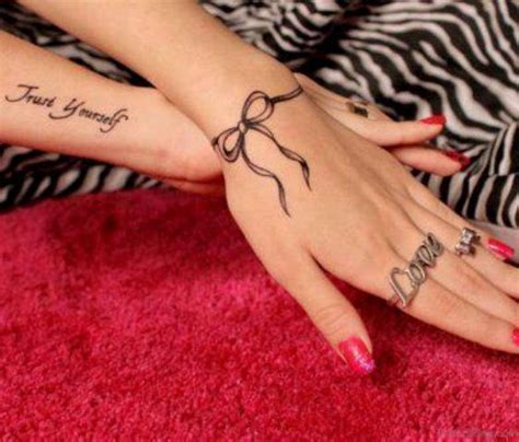 Get inspiration for your wrist tattoos: 21 Bow Tattoos On Wrist
