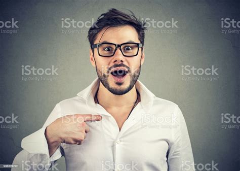 Excited Surprised Young Man Pointing At Himself In Disbelief Stock