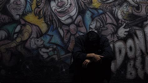 Sad Looking Man In Graffiti Wall Background 4k Hd Sad Wallpapers Hd