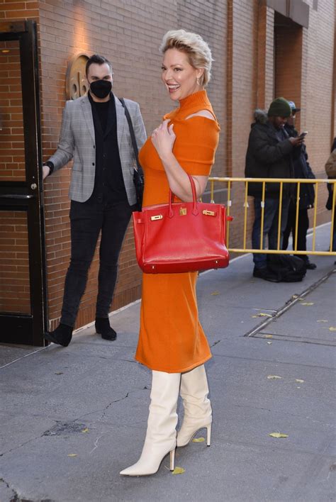 Katherine Heigl Wearing A Colorful Orange Dress With Cream Leather