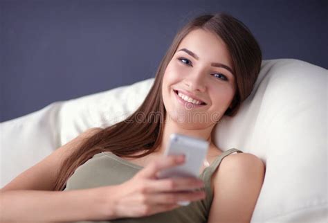 Pretty Woman In Her Living Room Lying On The Couch Sending Mess Stock Image Image Of Couch