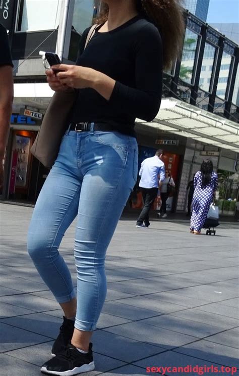 sexycandidgirls top hot legs in blue tight jeans on the street item 1