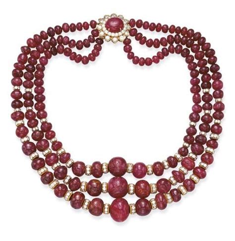 A THREE-STRAND RUBY AND DIAMOND NECKLACE, BY DAVID WEBB Each strand composed of graduated r ...