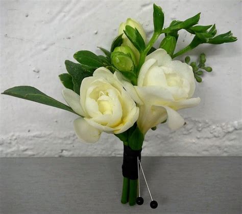A Double White Freesia Boutonniere By Studio Ag Bridal Bouquet