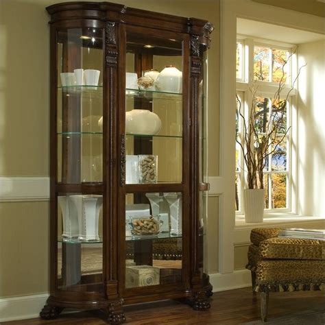 Most cabinets come with a door that swings open but this one is equipped with a sliding door that's on ball bearing guides. Pulaski Foxcroft Curved End Curio Cabinet - 102003
