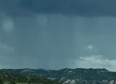 Cold Air Funnels Localized Flooding Accompany Passage Of Thunderstorm