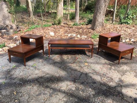 This dresser has five full sized drawers, the third of which has a solid wood dividing panel in the center for organizational purposes. Broyhill Premier Saga mid Century set Coffee table and end ...
