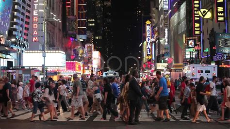 Crowd of people walking crossing street at night in Times Square slow motion 30p Stock Footage,# ...