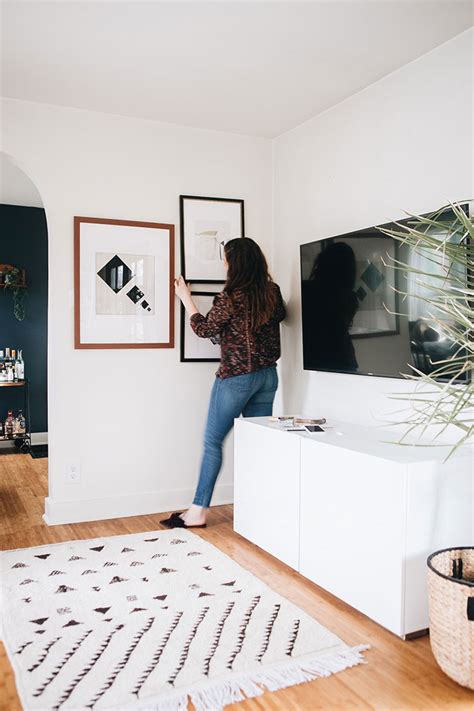 How to decorate a wall with a tv on it. the easiest way to decorate around a big tv: a gallery wall! | Jojotastic