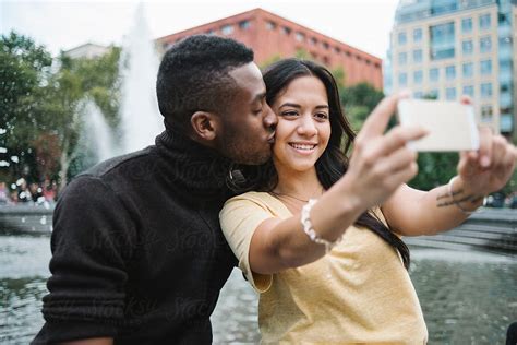 Couple Taking A Selfie In The City By Simone Wave