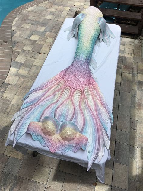 An Artisticly Designed Bed In The Shape Of A Mermaid S Tail On A Patio