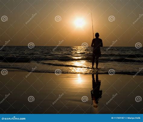 Man Fishing At Sunset Stock Image Image Of Warm Seashore 11769187