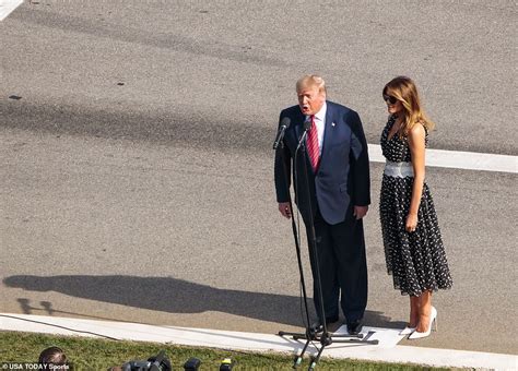trump and melania arrive at daytona 500 with air force one flyover and take a race track lap
