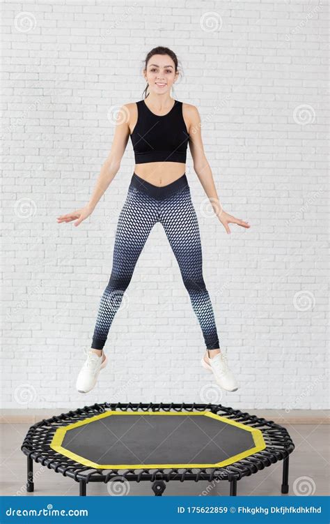Relaxed Woman Jumping On Trampoline Stock Image Image Of Club