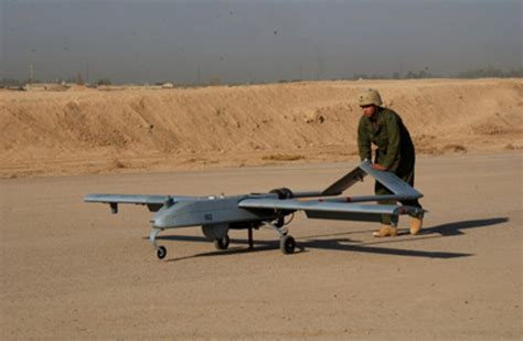 A Soldier Pushes A Shadow 200 Unmanned Aerial Vehicle In Preparation