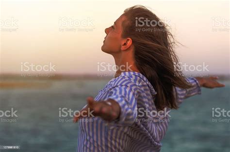 Woman Enjoying Freedom Standing Arms Outstretched Back And Enjoy Life