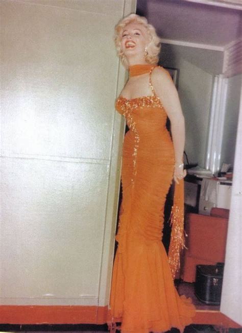 my oh my miss marilyn ms monroe looks a m a z i n g in this sparkly orange ball gown a gown