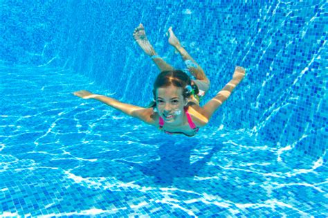 Happy Smiling Underwater Child In Swimming Pool Stock Photo Download