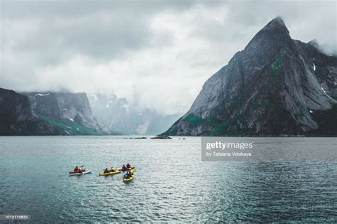 Group Of People Kayaking Near Reine Moskenes Lofoten