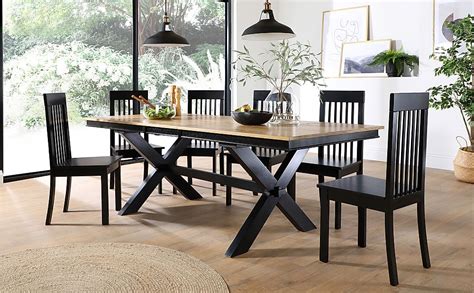 Mix and match your seating with a rustic bench, or opt for upholstered chairs in fabric and leather finishes. Grange Painted Black and Oak Extending Dining Table with 8 ...