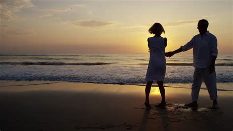 couple silhouette at the beach sunset light stock footage video 3600434 shutterstock