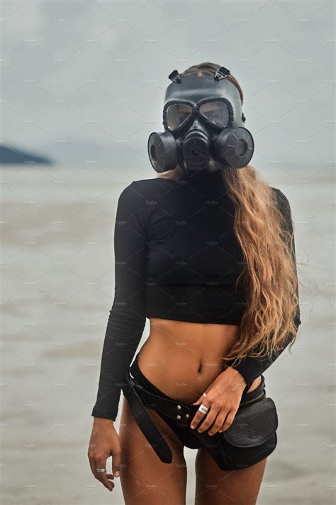 A Woman With A Pretty Body Wears A Gas Mask On The Beach Gas Mask