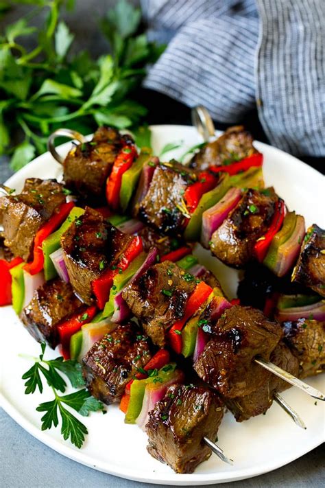 Turkish lamb shish kabob recipe is a big hit on special occasions. Shish kabob made with beef, peppers and onions on a serving plate. | Shishkabobs recipe, Kabob ...