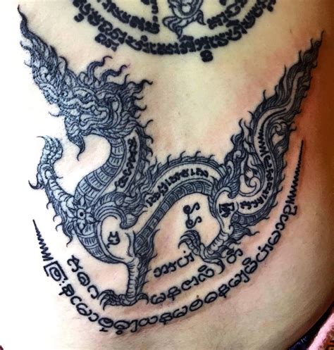 thai traditional style naga tattoo done by ajarn mhai bttattoo bambootattoo thaitattoo