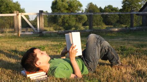 Boy Reads Book Outside Stock Footage Video 884482 Shutterstock