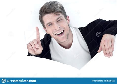 Businessman Bursting Through A Paper Wall And Showing Up Stock Image