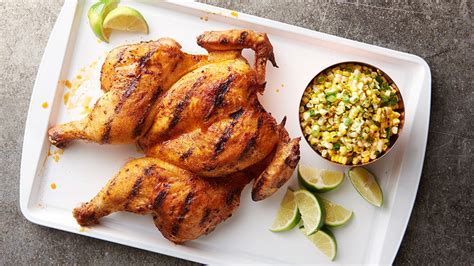 Get your grill heated, and most importantly, your fire burning clean. Grilled Spatchcock Chicken with Corn Salad recipe - from ...