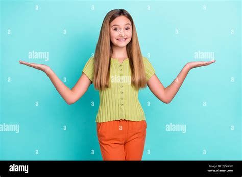 Portrait Of Positive Friendly Girl Arms Palms Hold Demonstrate Empty
