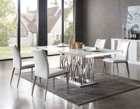 The top of this dining table is beautifully made up of textured granite which is supported by a the overall appearance of the dining table is very appealing and will suit your lavish drawing room. White Marble & Stainless Steel Dining Table VIG Modrest ...